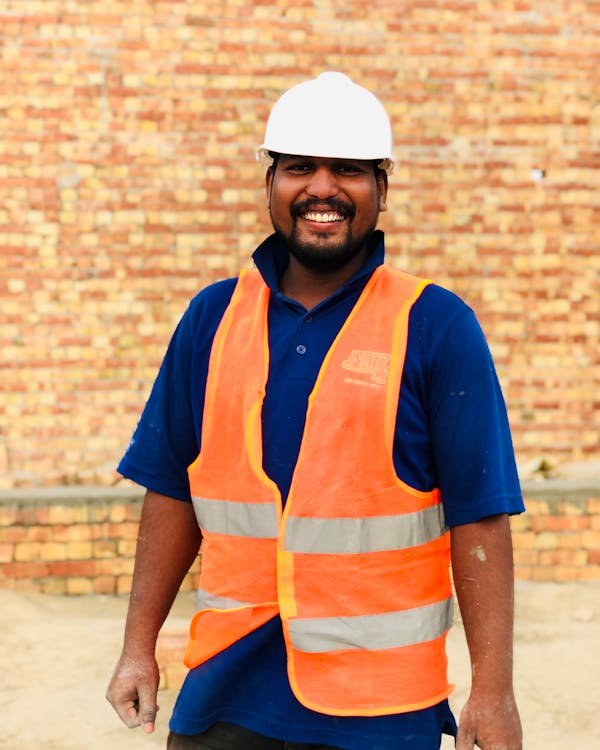 Friendly Indian worker smiling at a construction site